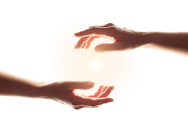 Light in the human hands isolated on white background