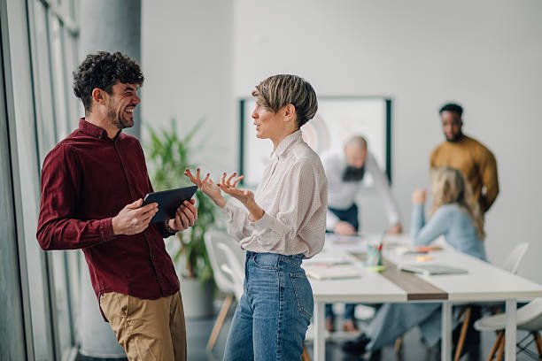 istock Business colleagues exchanging ideas in a modern office 2212957154