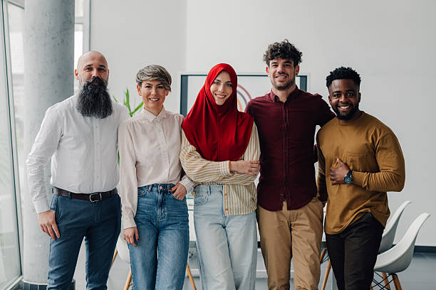 istock Five business colleagues smiling together in modern office 2212957186
