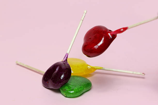 istock Colorful Lollipops isolated on a pink background. 2212958303