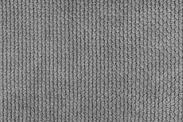 istock Texture of velour jacquard gray fabric close up, macro. Cloth structure, textile background 2212964325