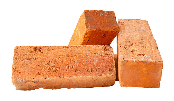 istock Side view of three old red or orange bricks in stack isolated on white background with clipping path 2212964843
