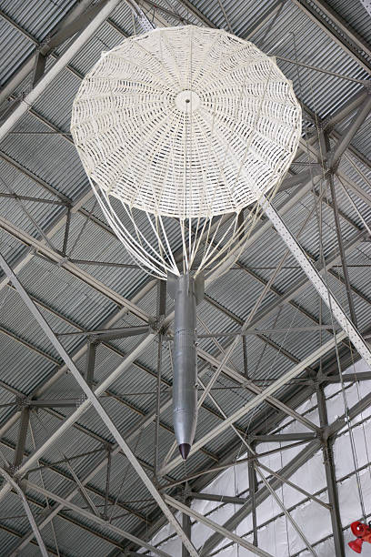 Conceptual image of spaceship and moon in daytime sky