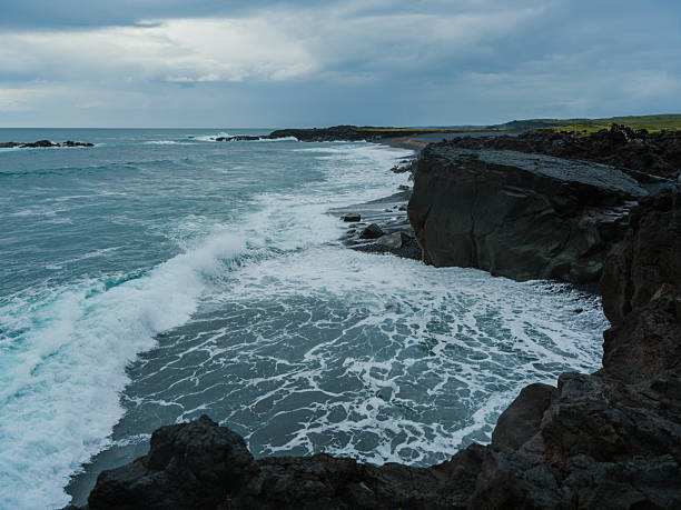 Epic views of rugged volcanic cliffs at  seaside in Iceland