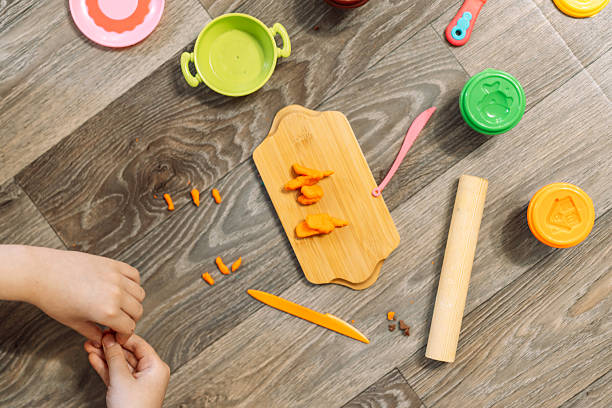 istock A child plays with plasticine and sculpts various figures 2212974072