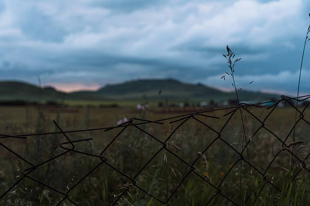 Rain clouds over the mountains at sunset.