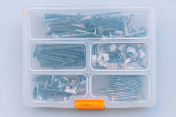 Closed plastic box with special compartments for screws and nails.