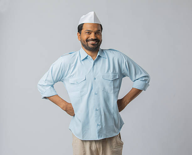 istock Taxi driver in topi posing over white background 2212988979