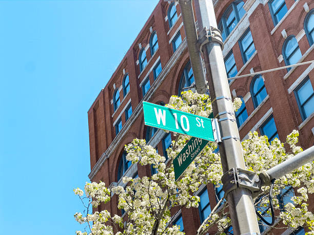 istock Blossoming tree and road sign 2212989035