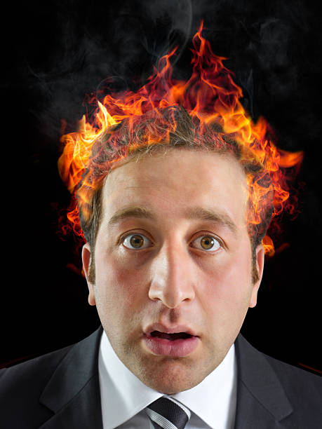 istock Businessman iwth burning head 2212989144