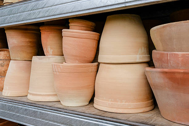Flower pots on a shelf in a garden centre.