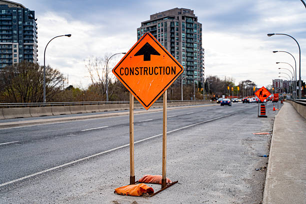 istock View of a construction sign on the highway. 2212992433