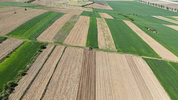 istock Aerial view of rural agriculture fields, spring time 2212992568