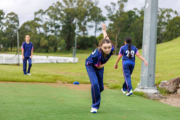istock Young female cricketer bowling a cricket ball at training 2212992714