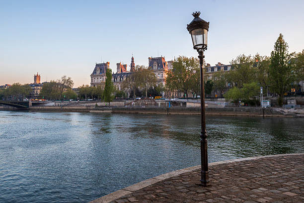 Photographed on Ile Saint-Louis looking towards the west. Hotel de Ville can be seen on the right bank.