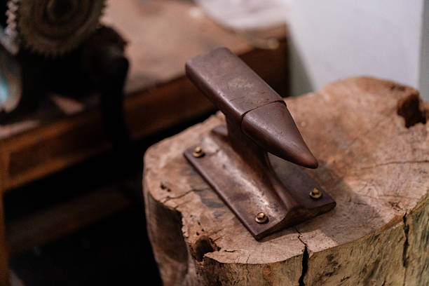 istock Jeweler's Anvil on Wooden Work Surface 2212997762