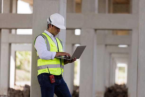 istock Portrait mid age man civil engineer hoking laptop at work site 2212997784