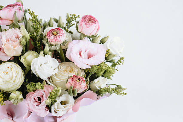 istock Beautiful floral arrangement featuring pink and white flowers in a soft setting 2212998972