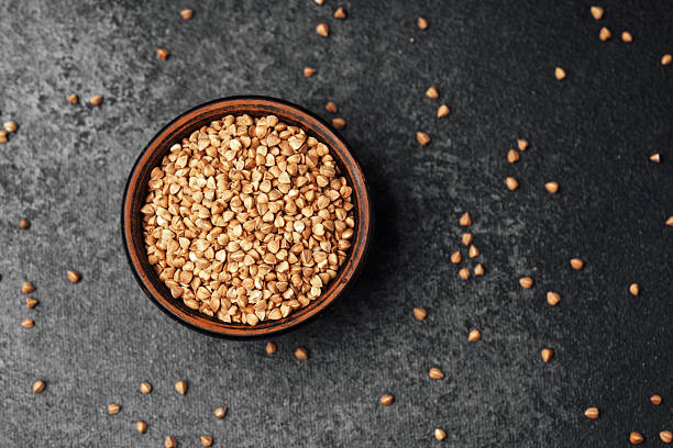 istock High-quality sesame seeds in a rustic bowl on a dark surface 2212999048