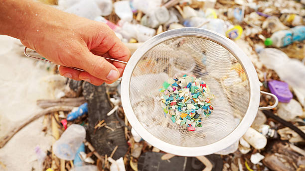 istock plastic particles or microplastics on a polluted beach, water pollution, ocean 2213001850