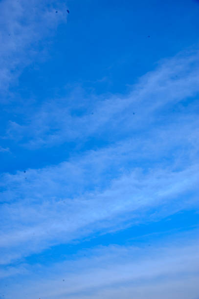 istock vivid blue sky with white clouds for background wallpaper 2213006399