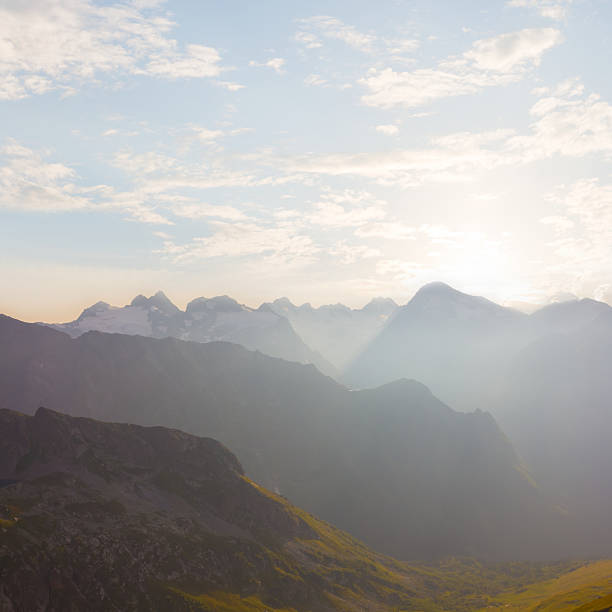 mountain chain silhouette in light of evening sun