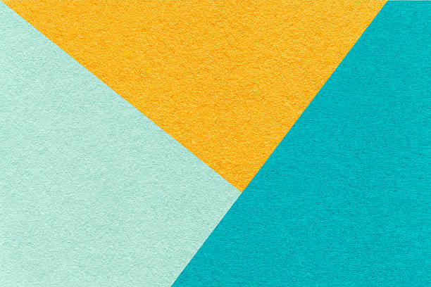 istock Texture craft mint, yellow and turquoise paper background, macro. Structure vintage cerulean abstract cardboard 2213009292