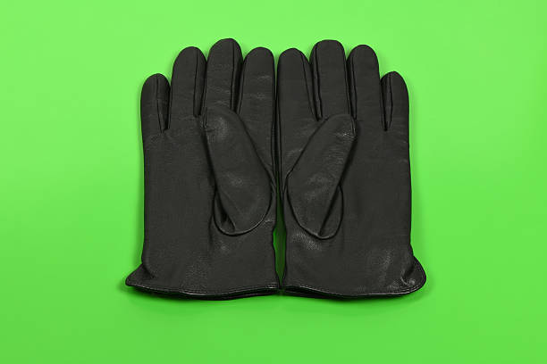 istock Casual leather gloves isolated on green background 2213012496