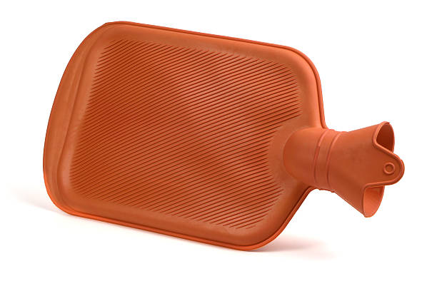 Rubber water warmer bag on wooden background