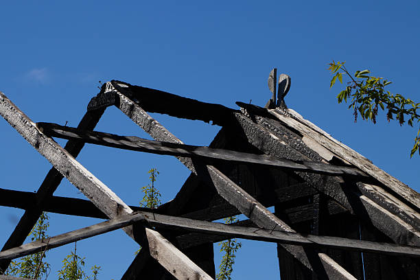 istock Charred Roof Structure Against Blue Sky 2213013585