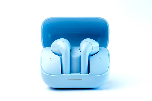 istock Stylish wireless earbuds with a sleek blue design and compact charging case. Features noise cancellation, high-quality sound, and Bluetooth connectivity. Ideal for music, calls, and travel. 2213013867