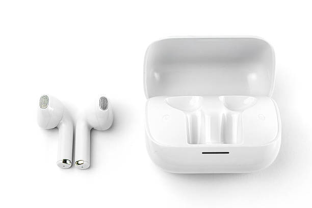 istock Modern white wireless earbuds with a matching charging case. Ergonomic fit, lightweight, and perfect for music, calls, gaming, and workouts with high-quality sound and noise isolation 2213013985