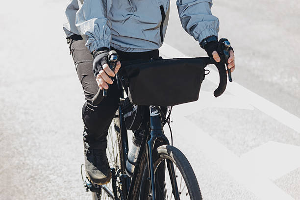 istock cyclist rides on asphalt road 2213014964