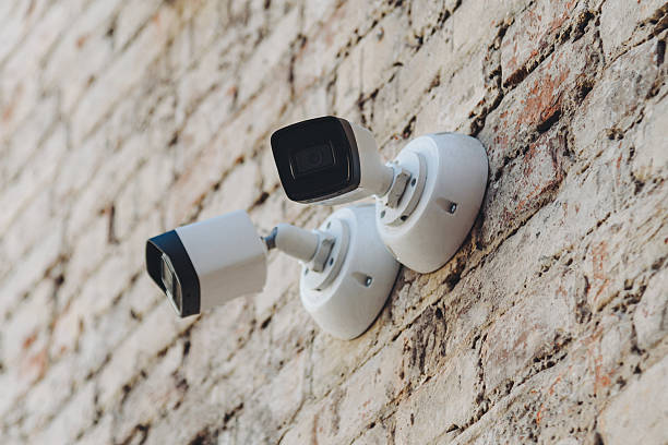 istock two video cameras attached to wall 2213014975