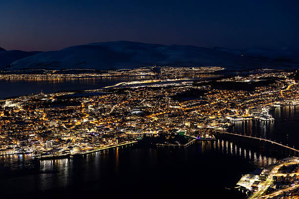 istock Norwegian coastal town in wintertime - Tromso by night 2213016215