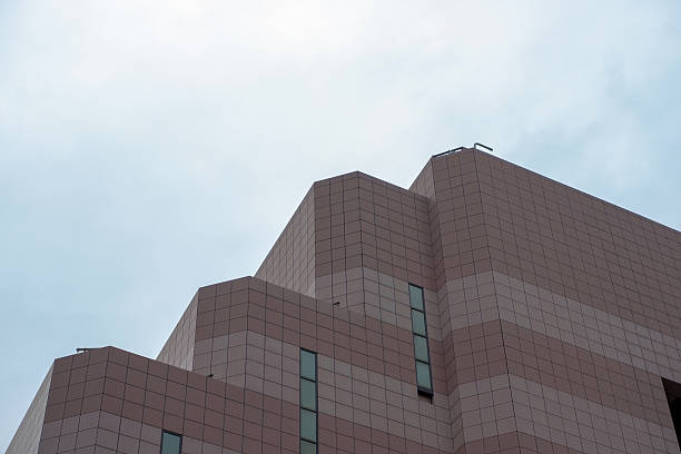 Low angle view of modern office building skyscraper, Sydney, white background with copy space, full frame horizontal composition
