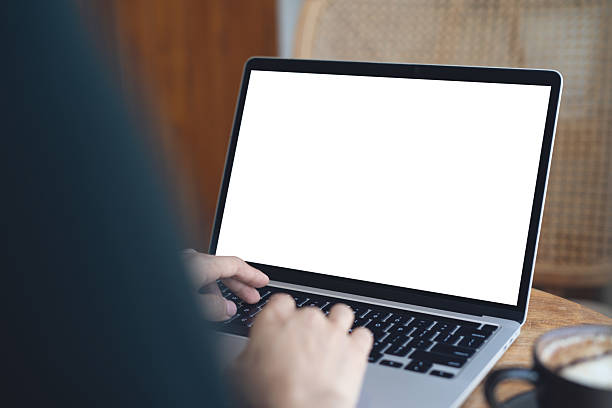 istock Laptop computer mockup, Woman working on laptop with blank white screen, template for web advertising, online marketing. Business woman searching information on desk at coffee shop. 2213017687