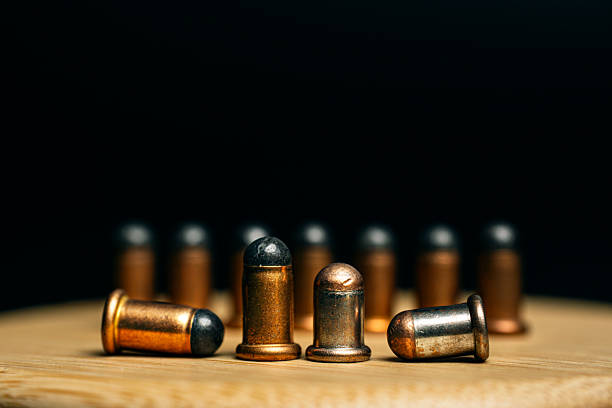 istock Close-up of 9mm bullets on a dark background. 2213020860