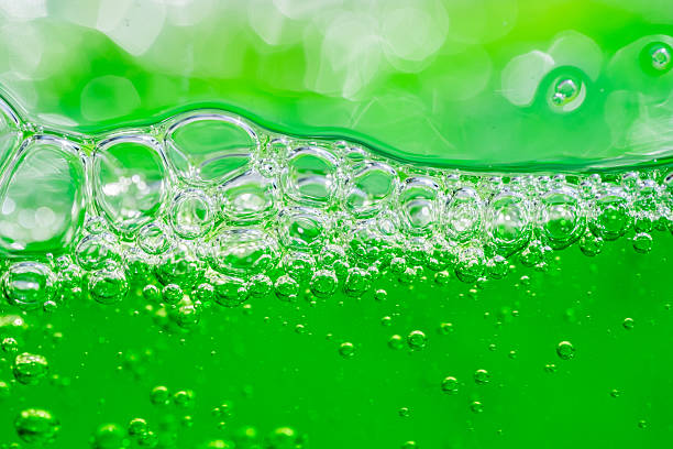 istock Water wave, close up of vibrant green liquid with bubbles, capturing dynamic movement and freshness. Perfect for backgrounds, beverages, or abstract concepts. soft drink 2213020901