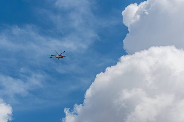 Poznan, Poland - 18 May 2024: Bolkow Bo105 helicopter - sky with clouds background.