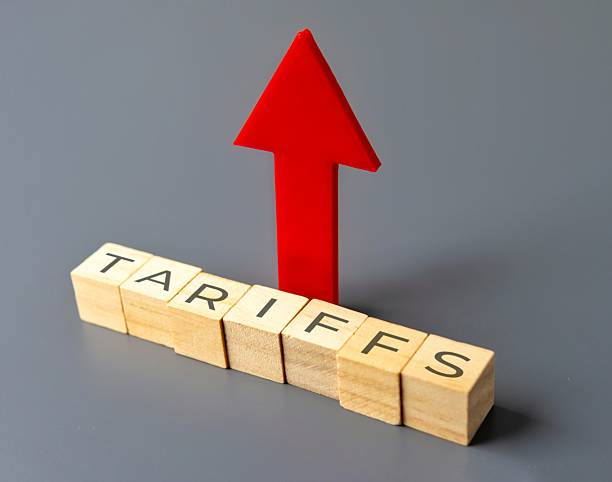 istock Upward pointing arrow and wooden blocks with word TARIFFS. 2213024916