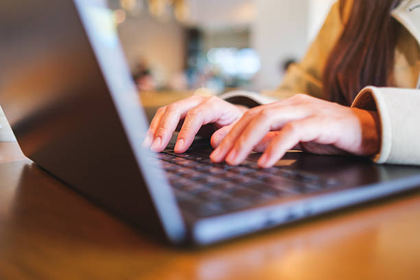 istock Closeup image of a woman hands working and typing on laptop computer keyboard 2213026078