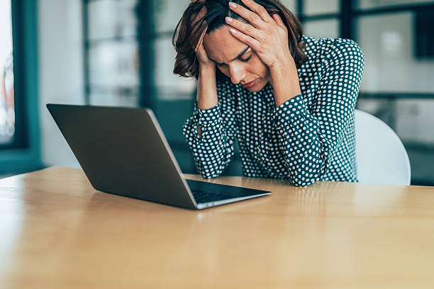 istock Exhausted Business woman with headache 2213026814