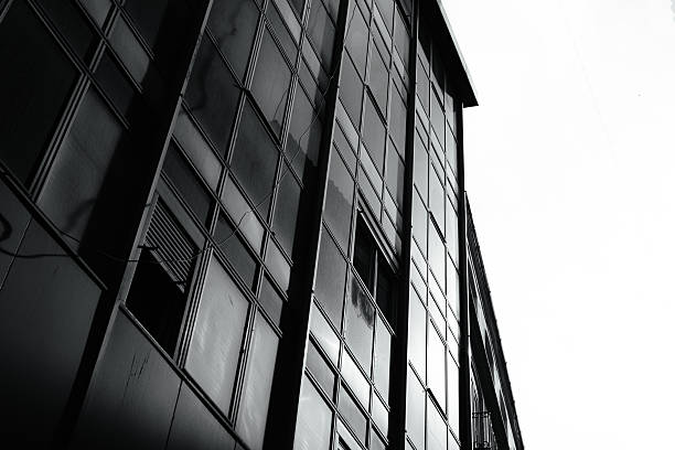 istock A modern office building illuminated from sun rays on moody day. 2213028337