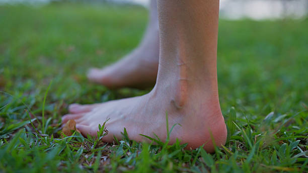 istock People standing and walking in the park. 2213034946
