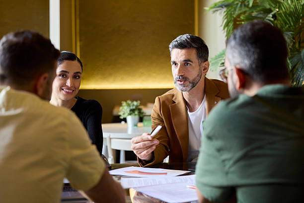 istock Business team discussing strategies at office 2213038190