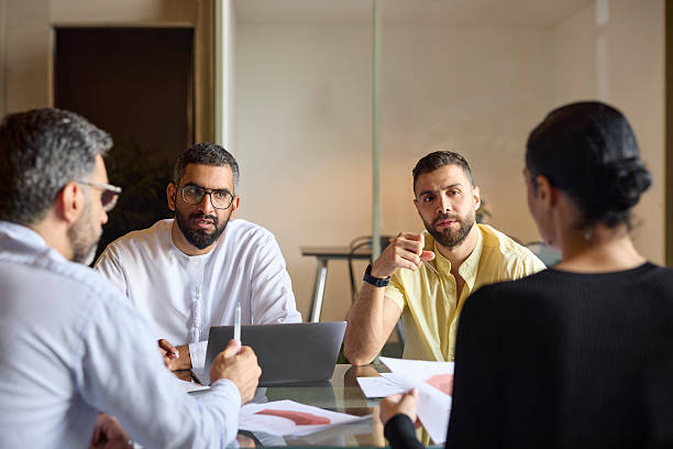 istock Entrepreneurs sitting in meeting with colleagues 2213038362