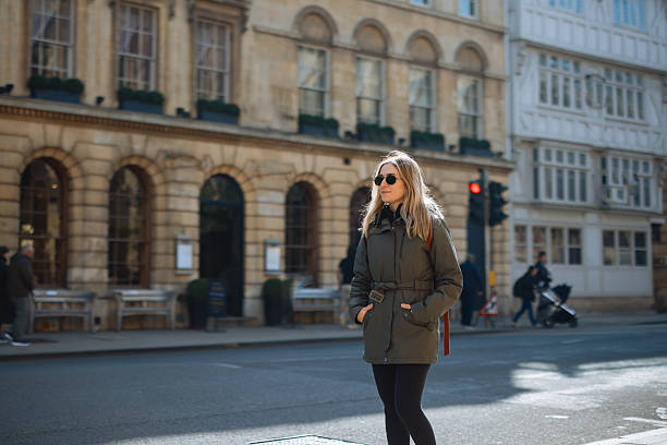istock Young Woman Walking along Oxford, UK 2213039816