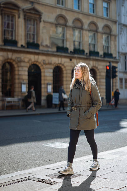 istock Young Woman Walking along Oxford, UK 2213040137