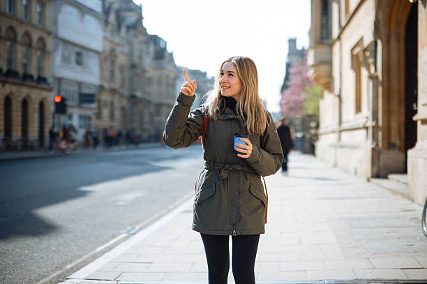 istock Young Woman Walking along Oxford, UK 2213040245